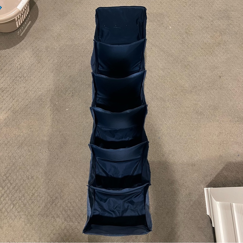 Hanging collapsible closet storage in navy blue